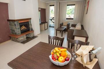 Фото номера Апартаменты с 1 спальней Отель Rhodopi Home Hotel - Half Board г. Чепеларе 3