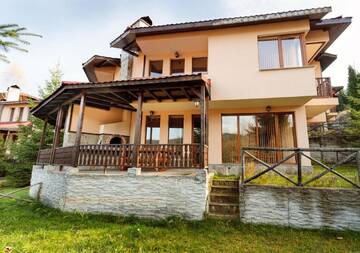 Фото номера Вилла с 3 спальнями Гостевой дом Rodopi Houses г. Чепеларе 3