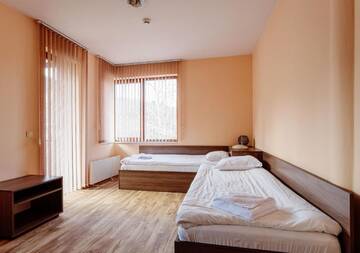 Фото номера Вилла с 3 спальнями Гостевой дом Rodopi Houses г. Чепеларе 8